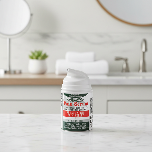 d-Lenolate Pain Serum bottle on a bathroom counter with a blurred background